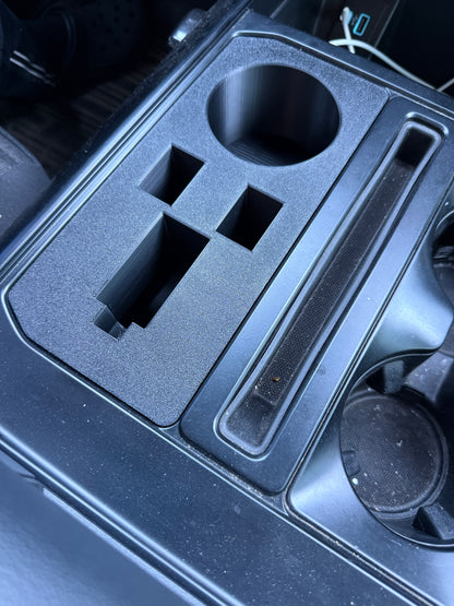 Custom black Ford F-150 console insert with OEM-style textured finish and precision fit design