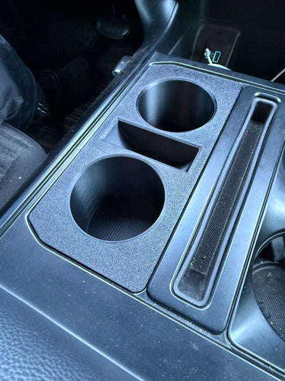 Custom black Ford F-150 double cup holder insert with OEM-style textured finish and precision fit