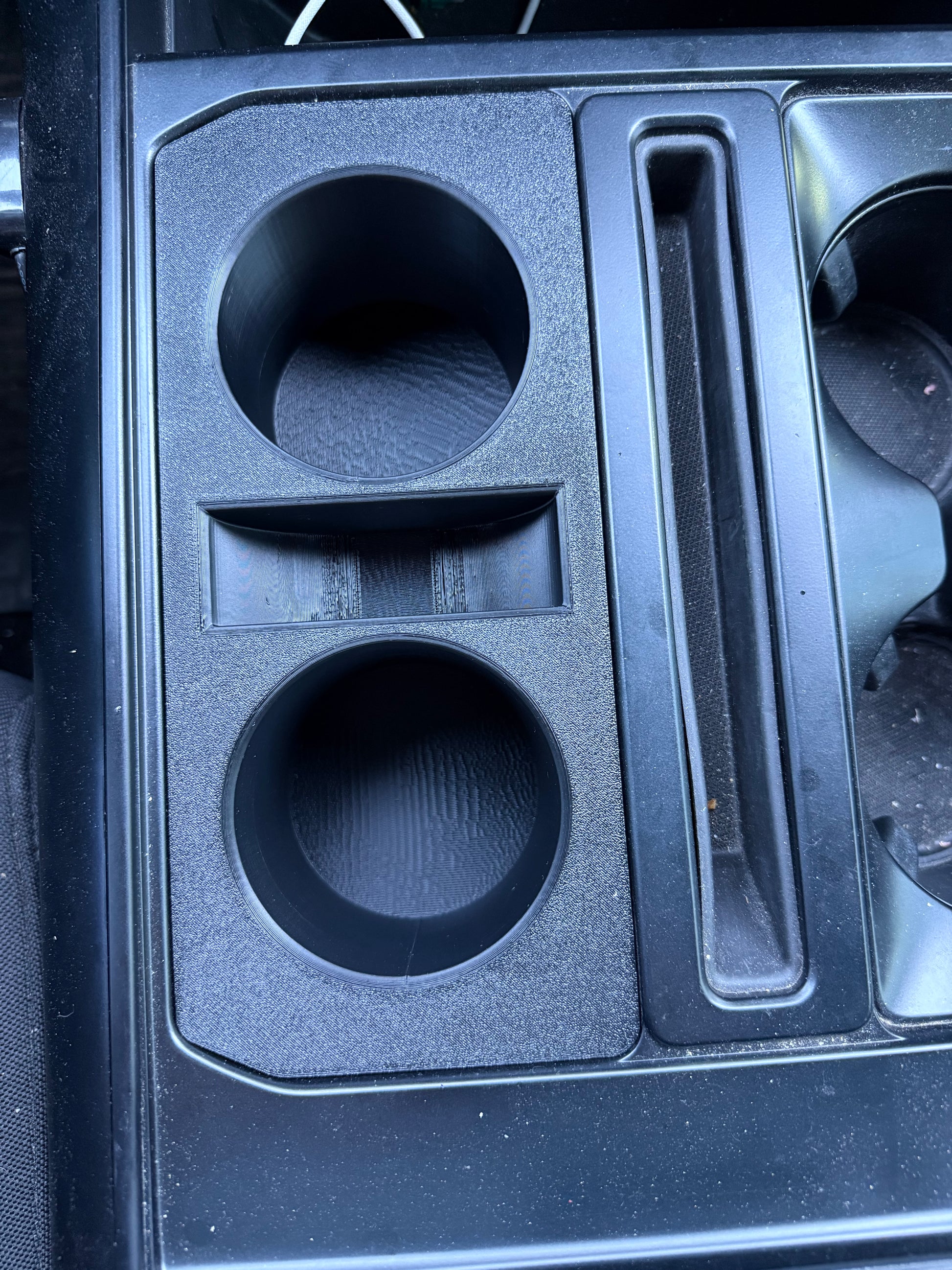 Ford F-150 center console organizer with dual cup holders and utility storage compartment