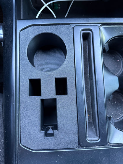 Ford F-150 center console organizer featuring cup holder, sidearm storage compartment, and utility slots