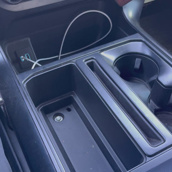 2021–2026 F150 console organizer demonstrating cup holder, sidearm compartment, and utility storage layout